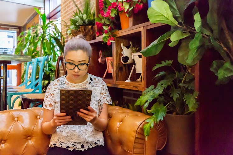 A lady reading a menu