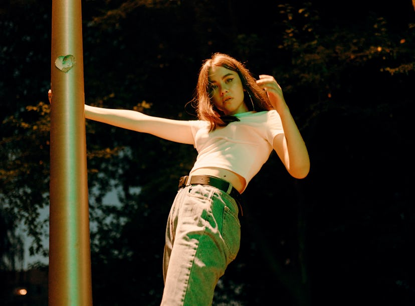 Young woman holding a pillar. Your chart ruler in astrology reveals so much.
